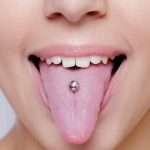 piercing lingua denti